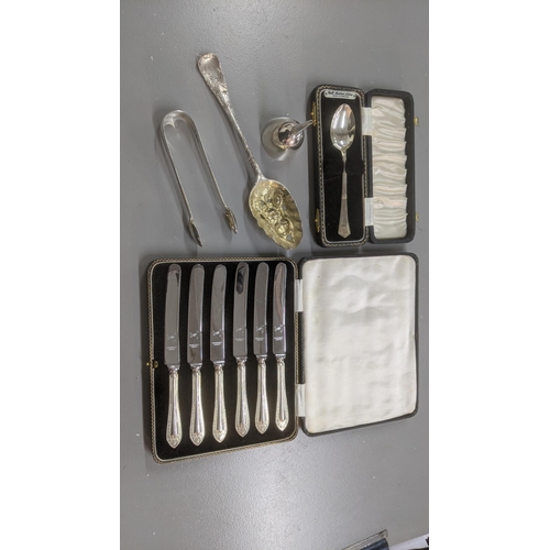 75 - Silver and white metal to include a set of six silver handled butter knives in a fitted cse, a pair ... 