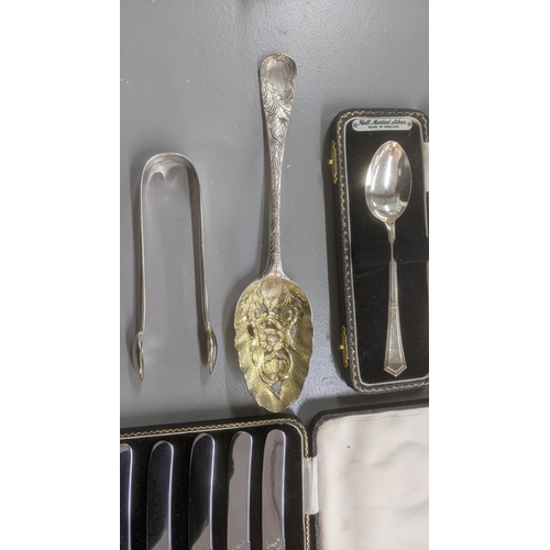 75 - Silver and white metal to include a set of six silver handled butter knives in a fitted cse, a pair ... 