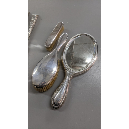 79 - Mixed silver dressing table items to include silver handled shoe horn and button hook, Birmingham 18... 