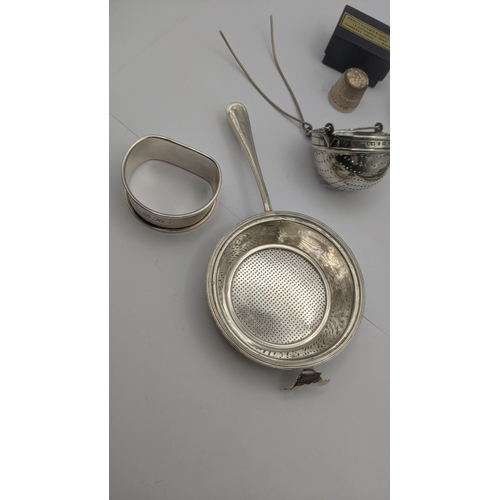 80 - Mixed silver to include two tea strainers, napkin ring, silver thimble and other items along with a ... 