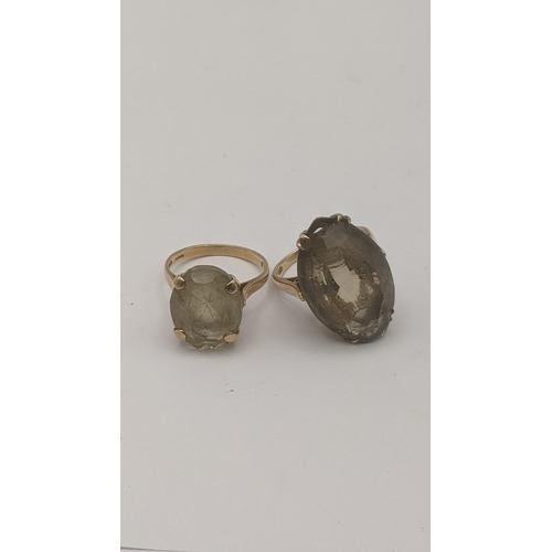 91 - Two 9ct yellow gold and quartz rings to include an oval cut lemon quartz in a four-claw setting, and... 