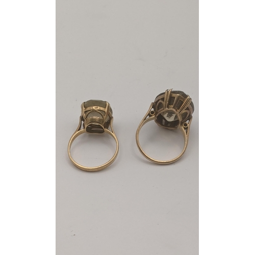 91 - Two 9ct yellow gold and quartz rings to include an oval cut lemon quartz in a four-claw setting, and... 