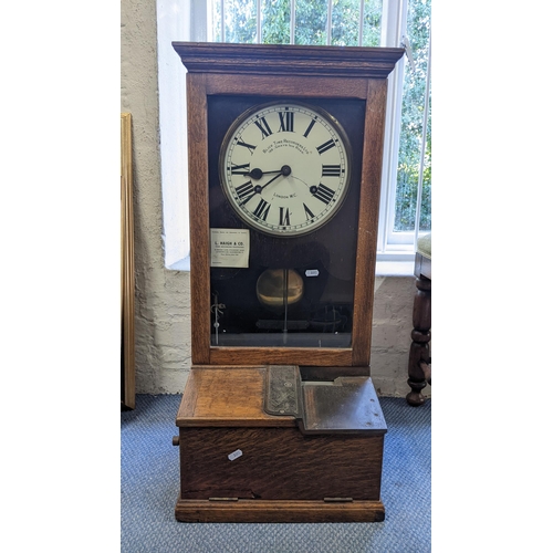 196 - An early 20th century oak cased Blick Time Recorders Ltd clocking in clock 82hx40w
Location LW8
If t... 