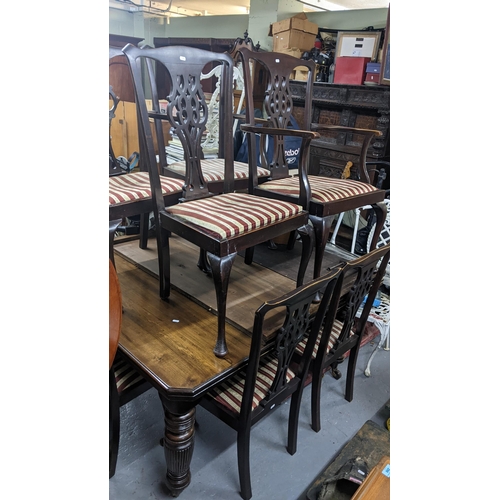 234 - An Edwardian mahogany wind-out extending dining table  with two extra leaves (with winding key) 73cm... 