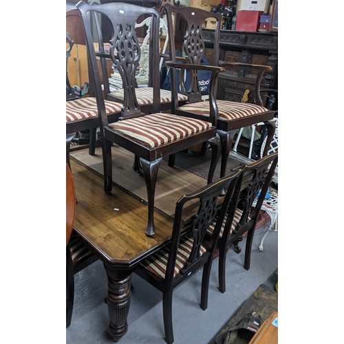 234 - An Edwardian mahogany wind-out extending dining table  with two extra leaves (with winding key) 73cm... 