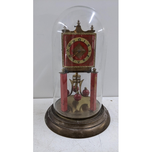 253 - A circa 1900 brass anniversary clock with a glass dome
Location: A1M
If there is no condition report... 