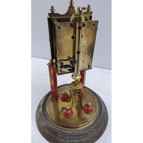 253 - A circa 1900 brass anniversary clock with a glass dome
Location: A1M
If there is no condition report... 