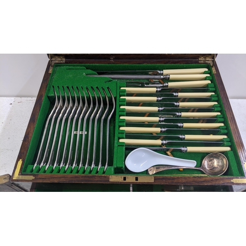 269 - An early 20th century oak silver plated canteen of cutlery by The Alexander Clark co Ltd.
Location A... 