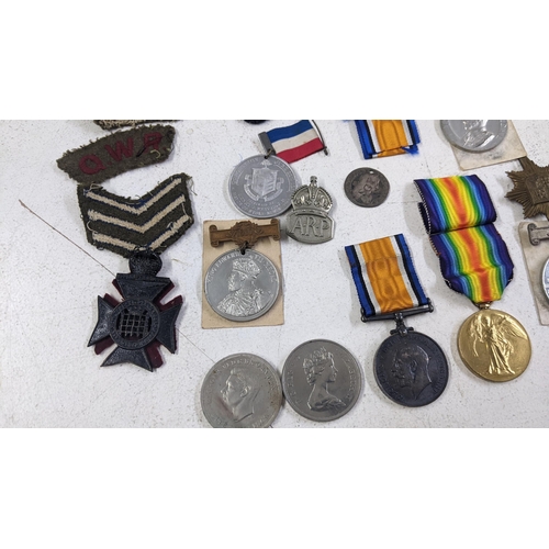 270 - A collection of medals and badges to include a WWI group named to 553265 PTE J Dickie 16 La an dR
Lo... 