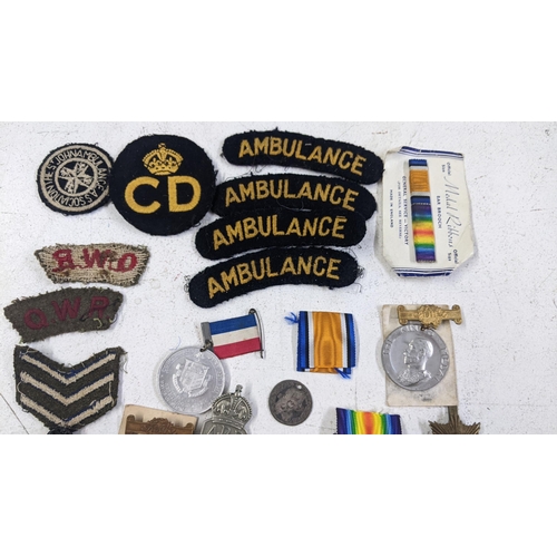 270 - A collection of medals and badges to include a WWI group named to 553265 PTE J Dickie 16 La an dR
Lo... 