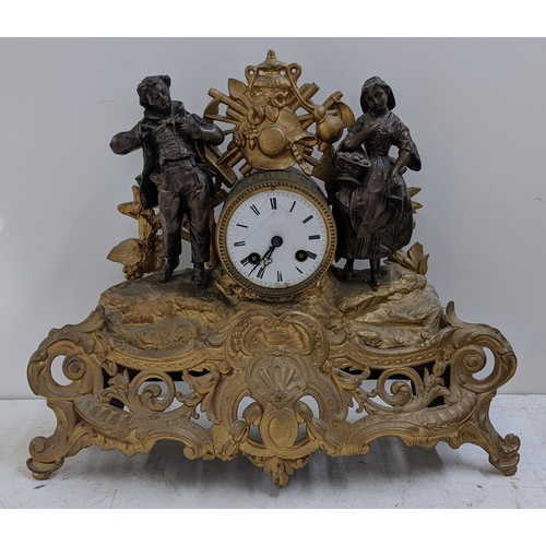 278 - A late 19th century French gilt metal mantel clock, the drum head cock flanked by two figures, the 8... 