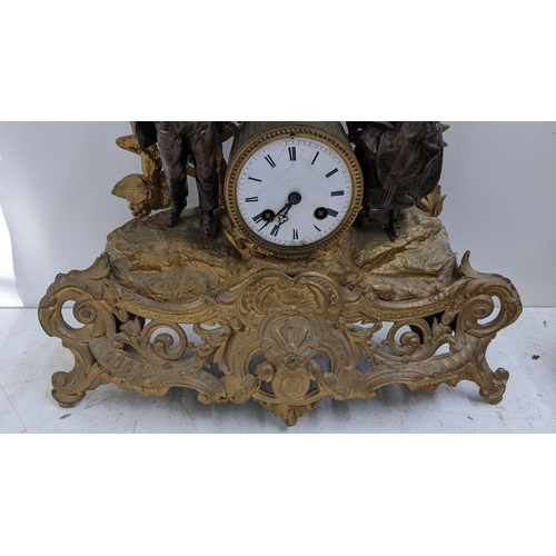 278 - A late 19th century French gilt metal mantel clock, the drum head cock flanked by two figures, the 8... 