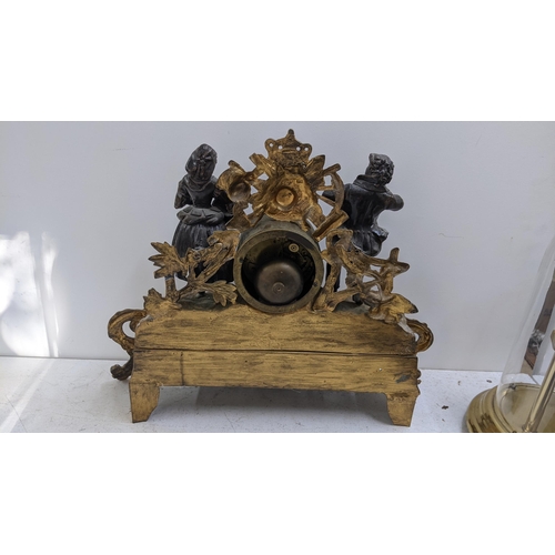 278 - A late 19th century French gilt metal mantel clock, the drum head cock flanked by two figures, the 8... 