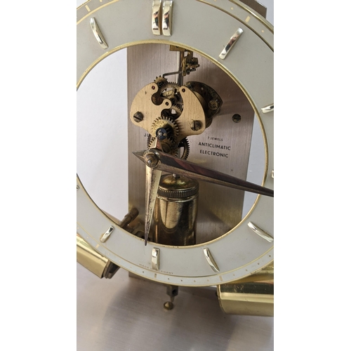 280 - A mid 20th century Junghans Anticlimatic Electronic clock under a glass dome, 23.5cm h x 22.5cm w
Lo... 