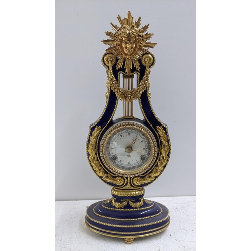 282 - A Marie Antoinette clock from the Victoria & Albert Museum in lyre from with gilt mounts, 39cm h 
Lo... 