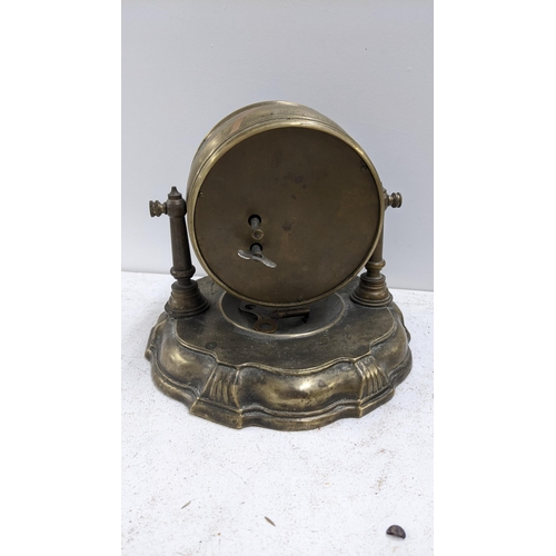 283 - An early/mid 20th century brass drum cased mantel clock with automaton monkey barber dial, 16cm h x ... 