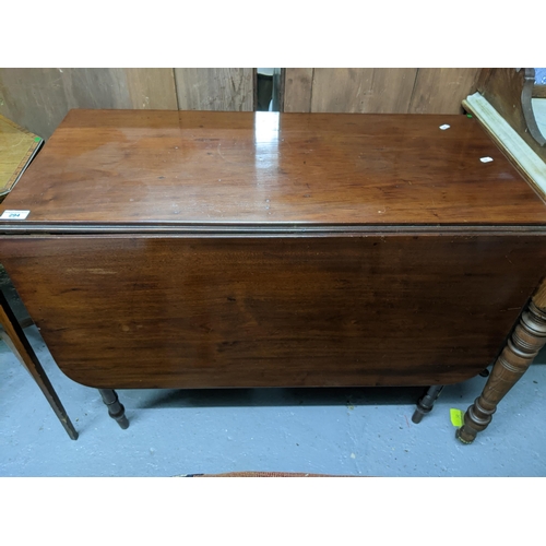 294 - A selection of small furniture to include a late Georgian mahogany drop leaf table 72cm x 90cm x 44c... 