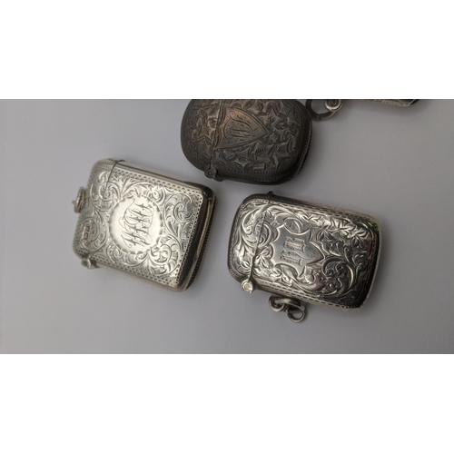 100 - A group of 5 silver vesta cases to include three floral engraved examples, and two others 
 Location... 