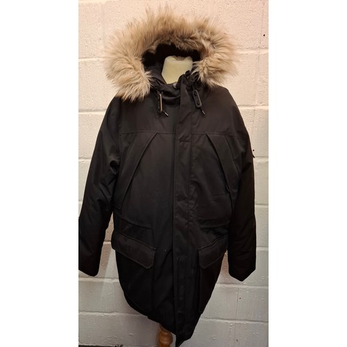 88 - A Penfield heavy duty black hooded coat with padded lining and faux fur trimmed hood, internal waist... 