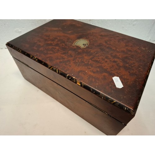 87 - A Victorian English burr walnut fitted sewing box to include 2nd Sylko branded cotton reels with 'si... 