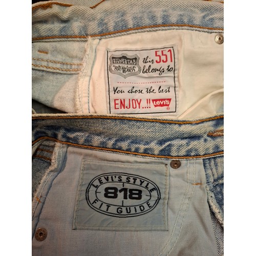 84 - Two pairs of Vintage stone washed Levi jeans comprising a pair of 551 Silver Medal wide leg jeans ap... 