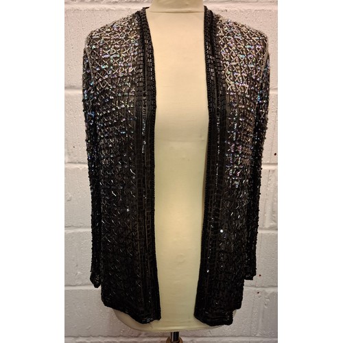 81 - A 1920'S Parisian black sequin and bead evening jacket with label 'La Paisienne Robe', approx 38