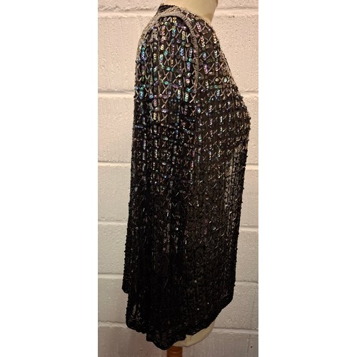 81 - A 1920'S Parisian black sequin and bead evening jacket with label 'La Paisienne Robe', approx 38