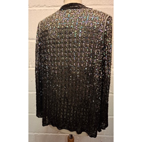 81 - A 1920'S Parisian black sequin and bead evening jacket with label 'La Paisienne Robe', approx 38