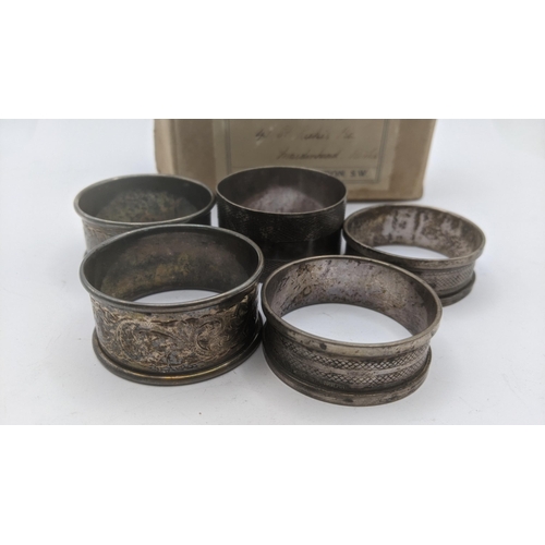 166 - Five silver napkin rings, each with engine turned decoration, total weight 66.9g Location:A4BT
If th... 