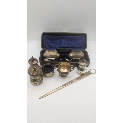 167 - Silver to include  pair of salts in a fitted case, a pepper grinder, a meat stick and others, total ... 