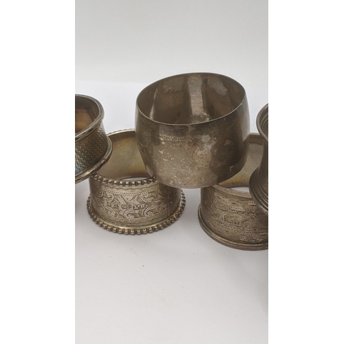 168 - A group of silver napkin rings, some having floral engraved decoration, total weight 136.7g Location... 