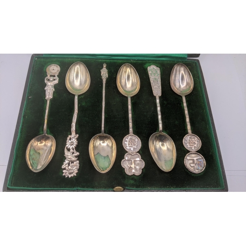 169 - A set of six Chinese silver spoons to include apostle examples and others in a green fitted case, to... 