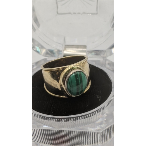 172 - A yellow metal signet ring with four interchangeable stones to include a malachite, lapis lazuli, co... 