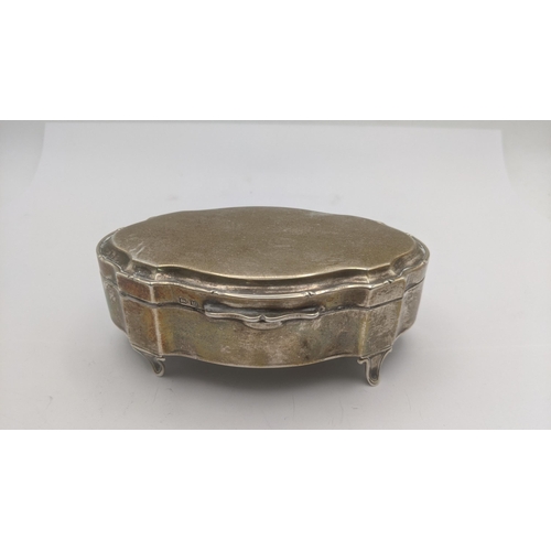 176 - A silver oval shaped ring box on four feet, hallmarked Birmingham 1944
Location: BWR 
If there is no... 