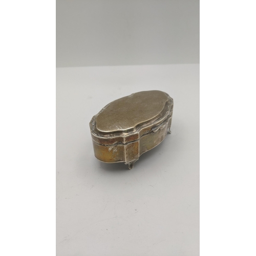 176 - A silver oval shaped ring box on four feet, hallmarked Birmingham 1944
Location: BWR 
If there is no... 