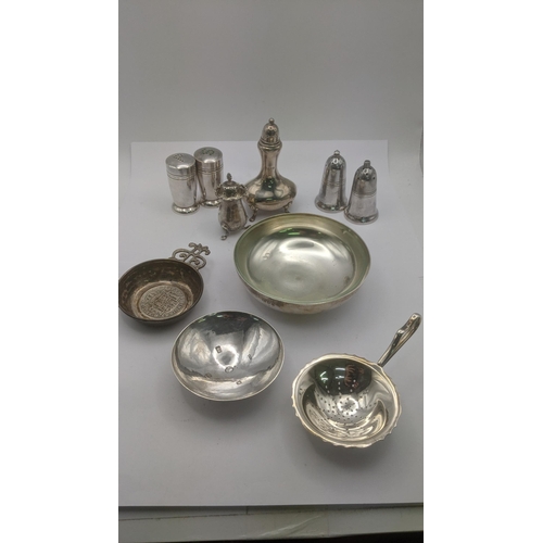 177 - Silver and silver plated items to include two pepper pots, a silver pin dish hallmarked London 1953,... 