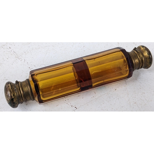 203 - An 19th century amber glass double ended scent bottle with brass stopper, 13cm 
Location: cab3
If th... 