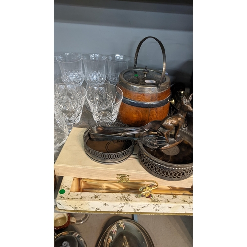 204 - A mixed lot to include glassware, biscuit barrel, Mdina bottle, silver plate including an entrée dis... 