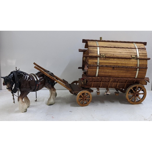 209 - A gypsy caravan model complete with contents and porcelain model of a horse, the caravan 39cm h x 42... 