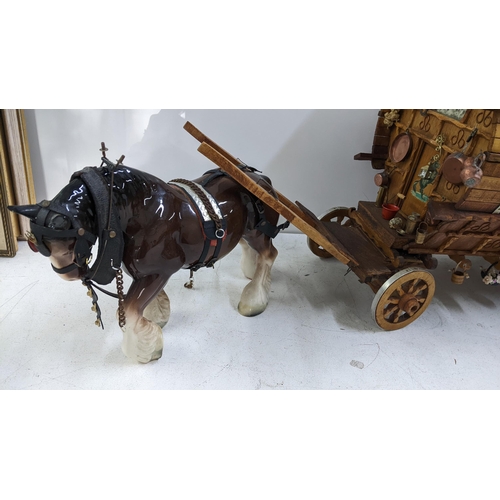 209 - A gypsy caravan model complete with contents and porcelain model of a horse, the caravan 39cm h x 42... 