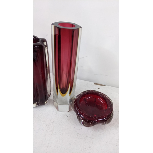 228 - A selection of art ruby coloured glassware to include two Sommerso Murano vases, and three Whitefria... 