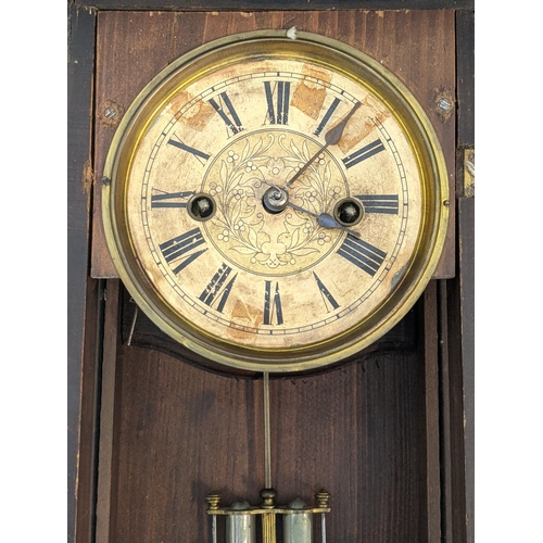 350 - An American mahogany veneered cased mantel timepiece by Waterbury Clock Company faced by a decorated... 