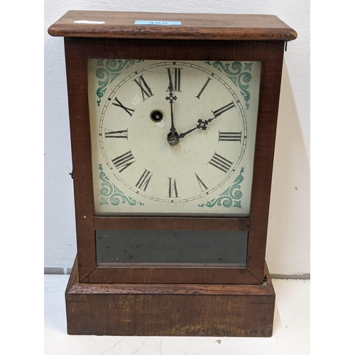 350 - An American mahogany veneered cased mantel timepiece by Waterbury Clock Company faced by a decorated... 