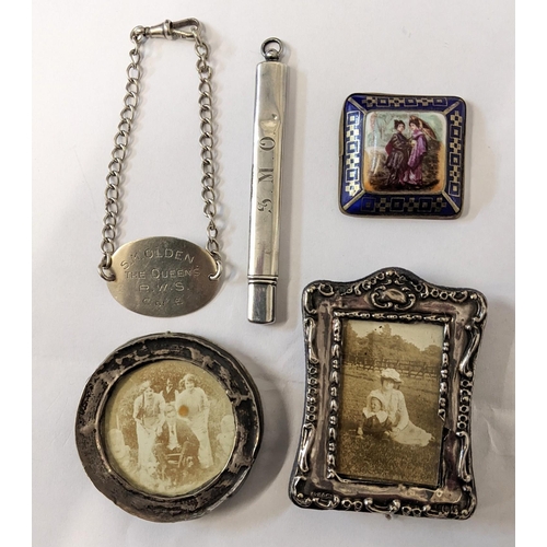 453 - Mixed silver items to include two photograph frames, decanter label and a pencil, together with a po... 