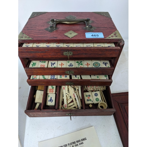 465 - A 20th century wooden cased Mah Jong set with bone and bamboo tiles, bone sticks and dice, the case ... 