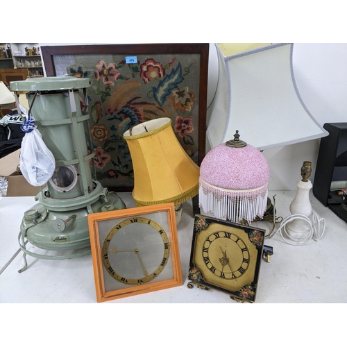 470 - A mixed lot to include four table lamps (three with shades), two strut clocks, Aladdin paraffin heat... 