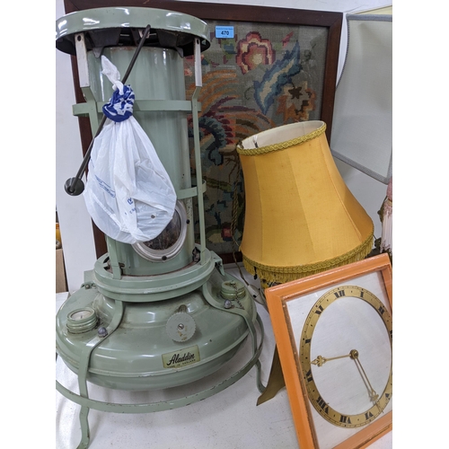 470 - A mixed lot to include four table lamps (three with shades), two strut clocks, Aladdin paraffin heat... 