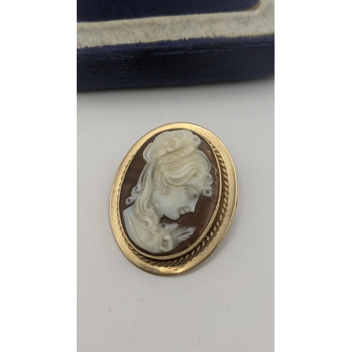 133 - A cameo brooch mounted in 9ct yellow gold together with a pair of 9ct yellow gold and pearl stud ear... 