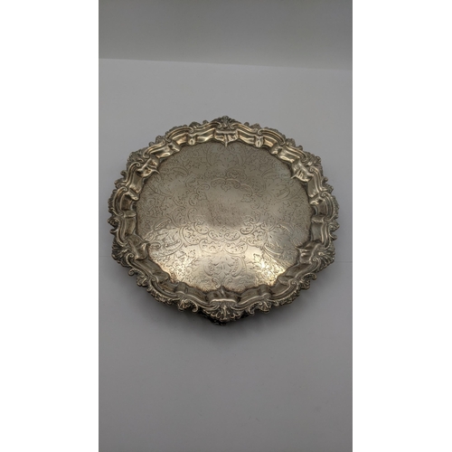 134 - A Barker Brothers silver tray on three feet with a floral engraved decoration hallmarked, Birmingham... 