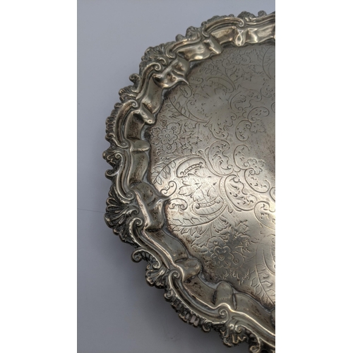 134 - A Barker Brothers silver tray on three feet with a floral engraved decoration hallmarked, Birmingham... 